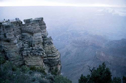 Photo:  View across Grand Canyon, with escarpment and figures