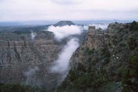 Thumbnail:  Looking down on clouds and patches of snow at the South Rim