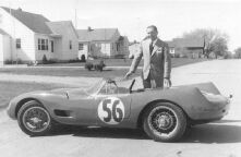 (Monochrome) photo: the US distributor stands  next to one of  the cars, 1957 Sebring class winner