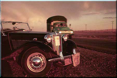 Photo: True color sunrise pinkout of MG TD and a passing truck, west of Albuquerque