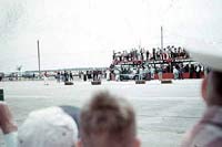 Thumbnail:  Moss on the pit counter with Aston-Martin reclining; CLICK the picture to go to the Sebring page that tells the story