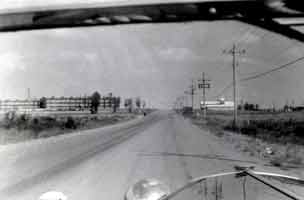 Thumbnail: view down a LRAFB road, barracks to the left,  chapel and other facilities to the right