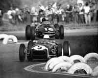 Thumbnail: head-on view as Moss leads Gurney through the T8 right-to-left-to-straight transition