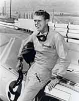 Thumbnail: photo of Steve McQueen, Turn One tunnel fence and Box Springs Mountain (915 meters) in the background